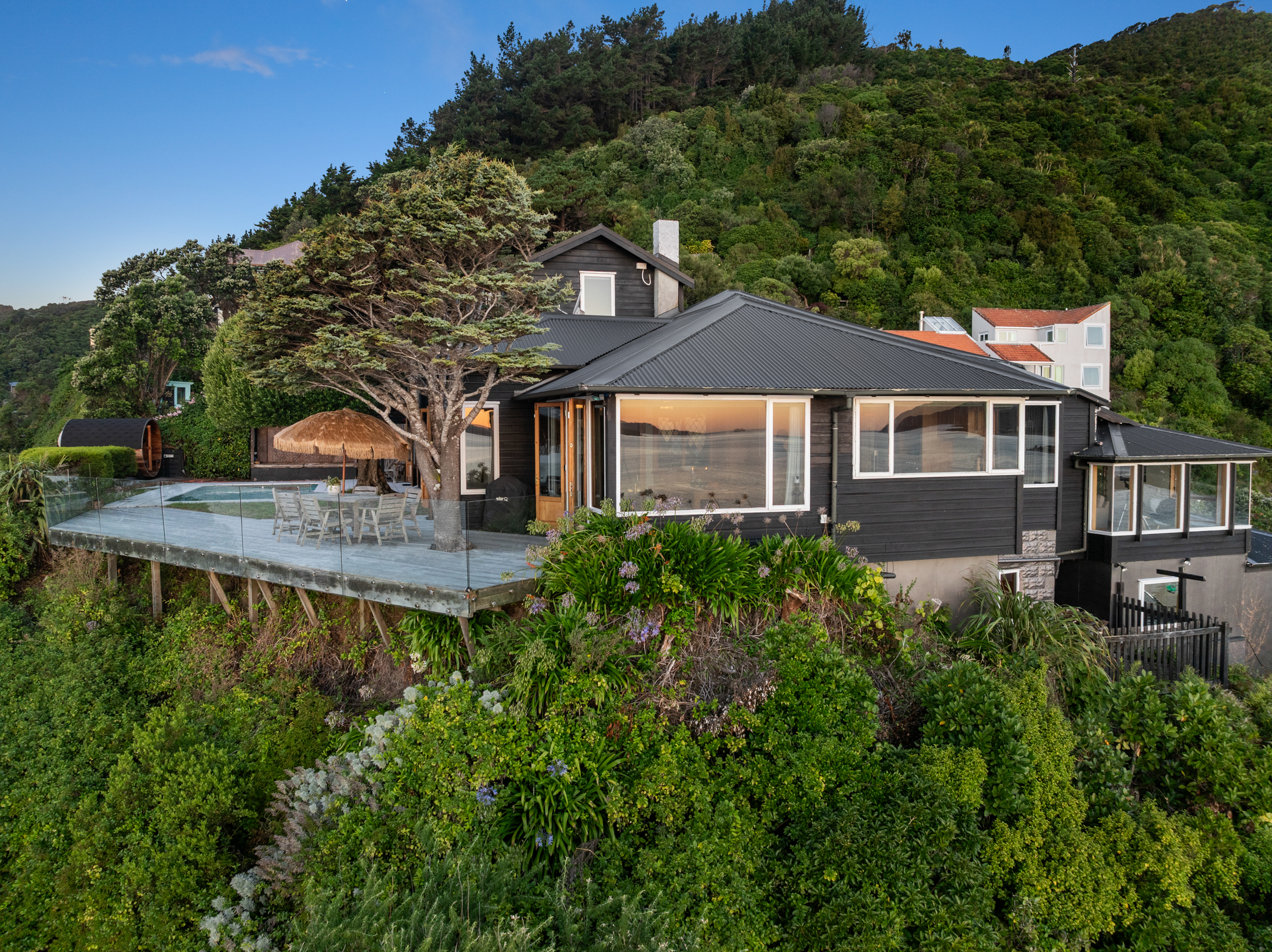 Coastal home nestled in hillside