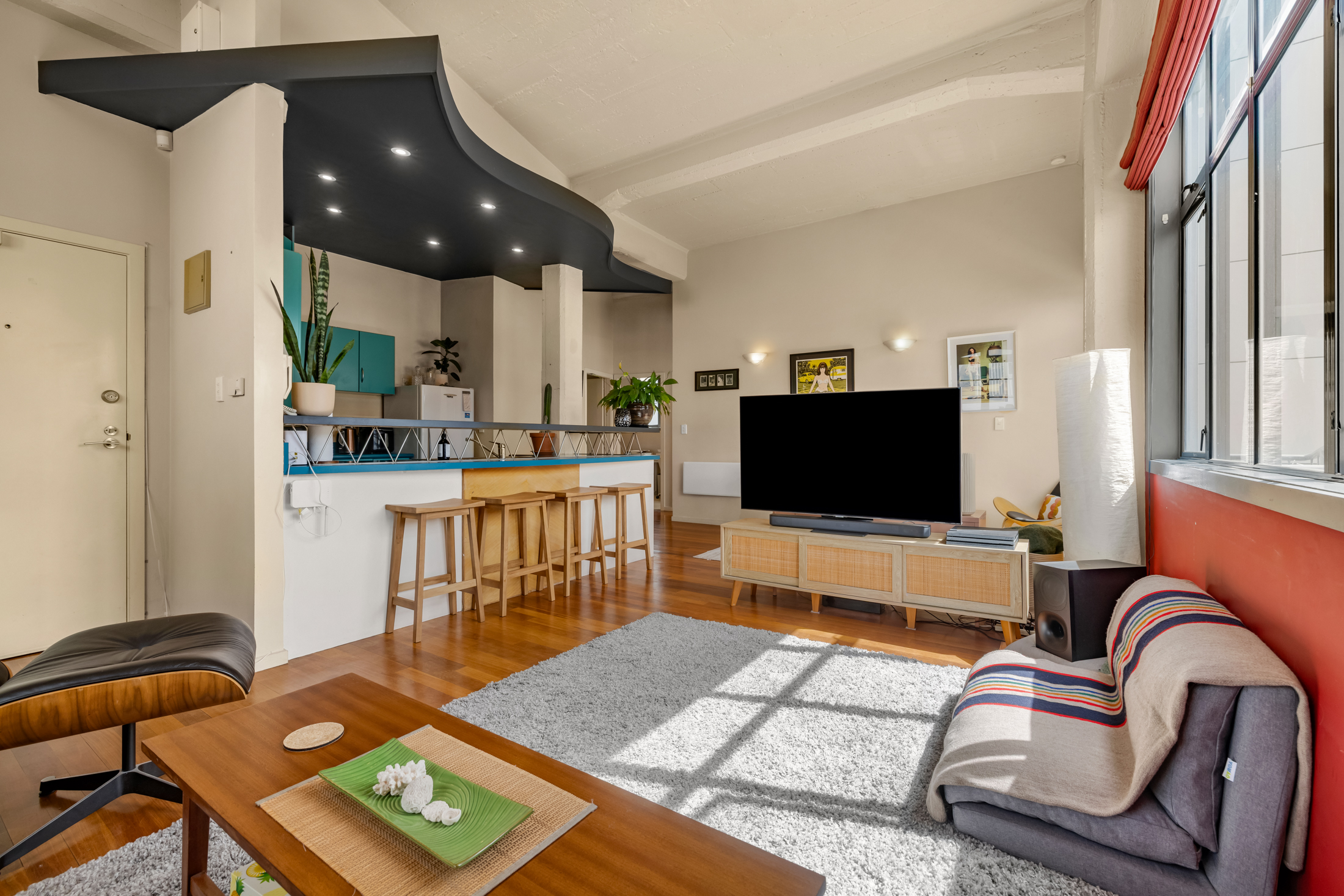 Open-plan loft living room and kitchen at 9 College Street